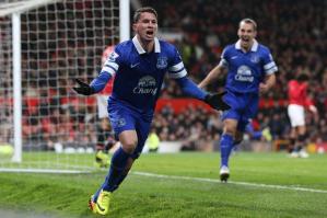 Oviedo, standing in for the injured Leighton Baines, celebrates his winning goal at Old Trafford.